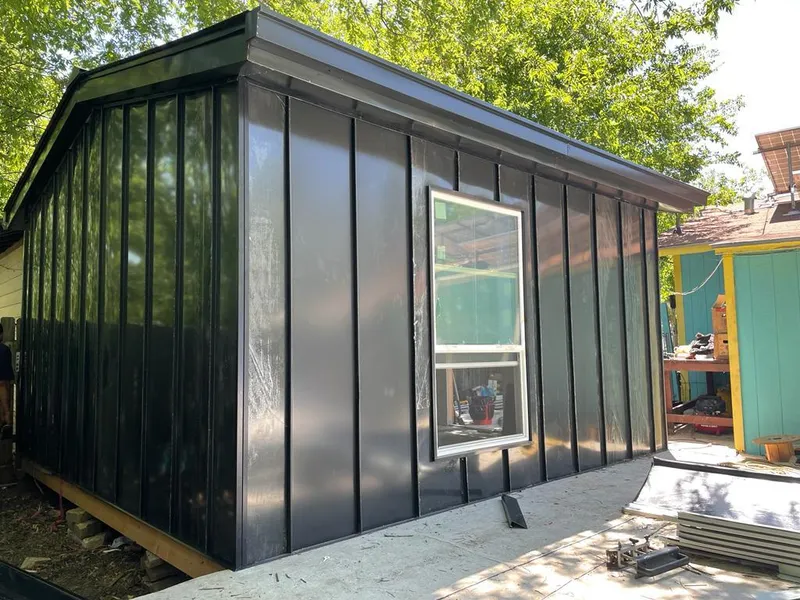 Black standing seam metal wall panels for Roof Inspection in Westlake