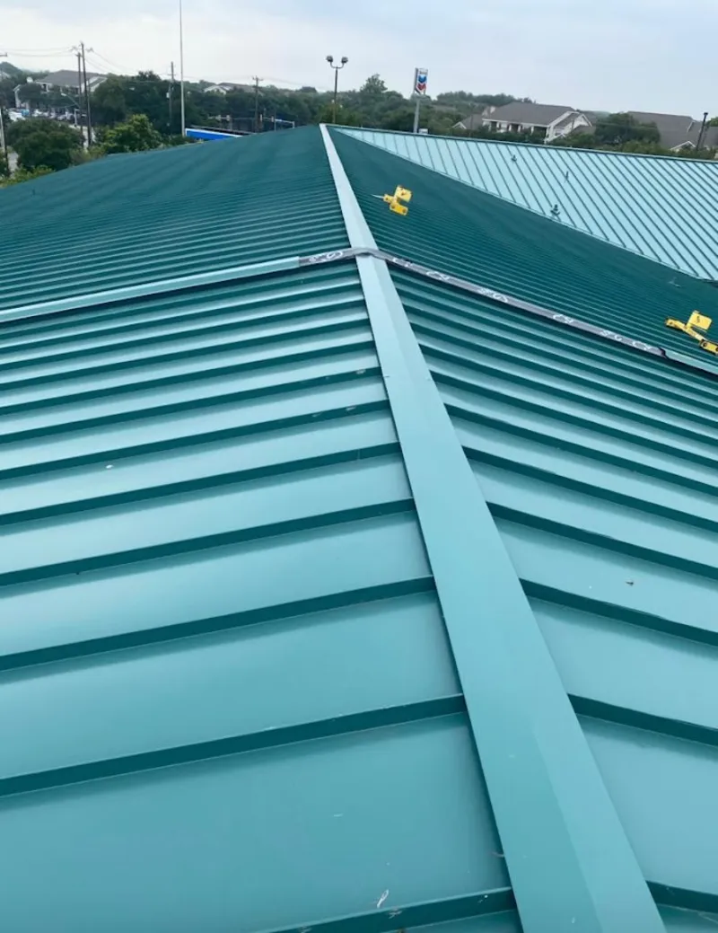Green commercial metal roof ridge and valley for Metal Roof Repair in Westlake